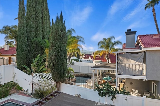 exterior space featuring a fenced backyard