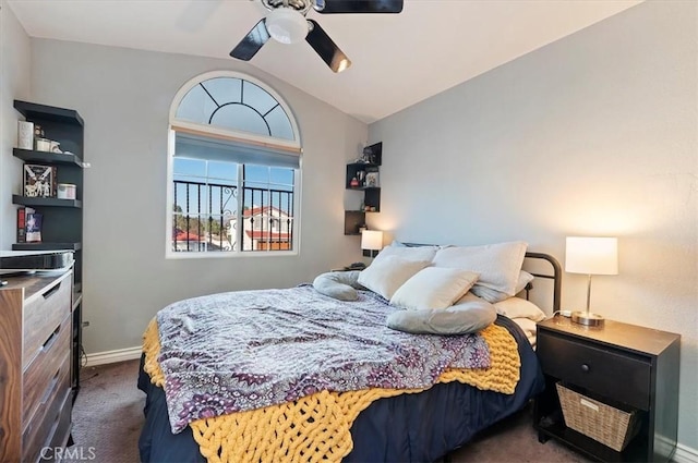 bedroom with a ceiling fan, carpet, vaulted ceiling, and baseboards