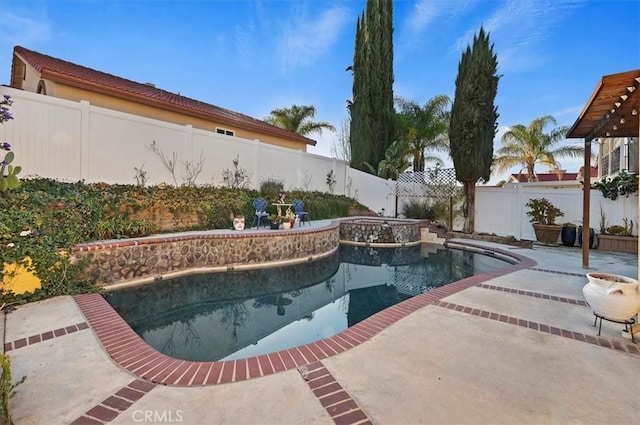 view of pool with a patio area, a fenced backyard, and a pool with connected hot tub