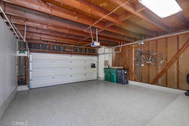 garage featuring a garage door opener