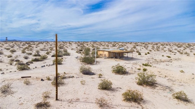 view of yard with view of desert