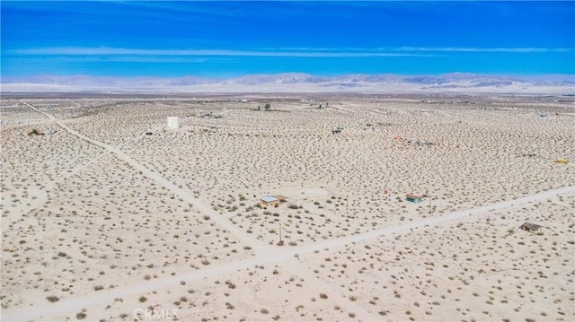 bird's eye view featuring a desert view and a mountain view