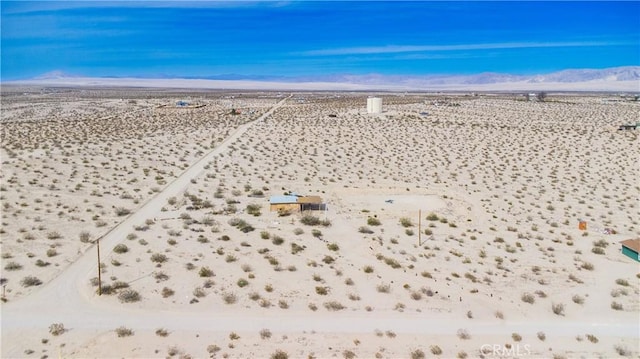 bird's eye view featuring a mountain view and view of desert