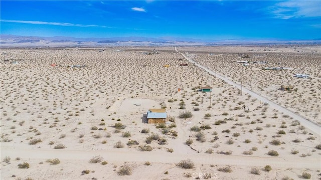 aerial view featuring view of desert, a rural view, and a mountain view