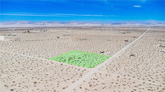 aerial view featuring view of desert, a rural view, and a mountain view