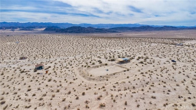 exterior space featuring a mountain view and view of desert