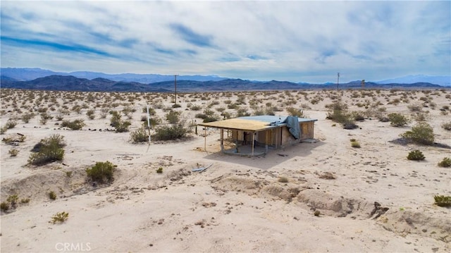 view of mountain feature with a rural view and view of desert