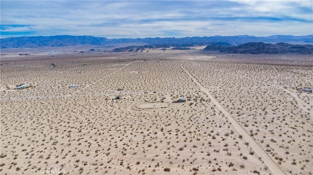 bird's eye view with a desert view, a rural view, and a mountain view