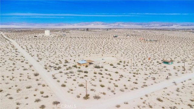 aerial view with a desert view and a mountain view