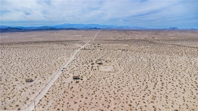 aerial view with a desert view and a mountain view