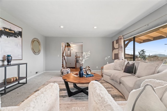 living room with carpet floors, baseboards, stairway, and recessed lighting