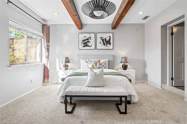 bedroom with beam ceiling, carpet flooring, visible vents, and baseboards