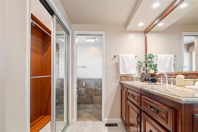 full bath with recessed lighting, visible vents, and vanity