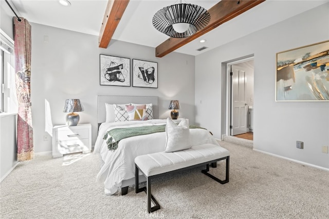 carpeted bedroom with beam ceiling, recessed lighting, visible vents, ensuite bathroom, and baseboards