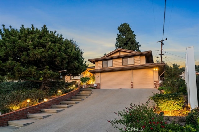 view of front facade featuring driveway and an attached garage