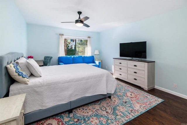 bedroom featuring dark wood-style floors, baseboards, and a ceiling fan