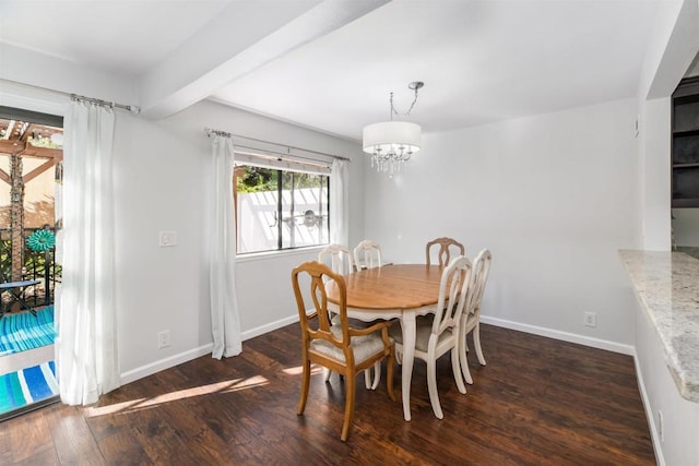 dining area featuring a notable chandelier, wood finished floors, and baseboards