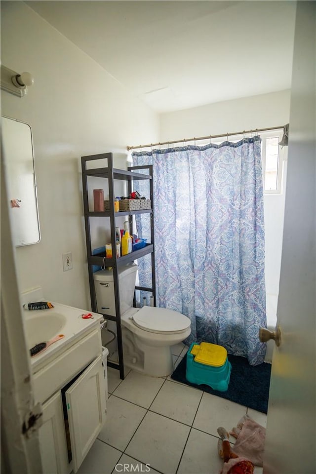 full bath featuring tile patterned flooring, a shower with curtain, vanity, and toilet