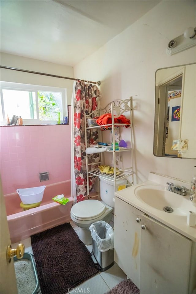 bathroom featuring shower / tub combo, tile patterned flooring, vanity, and toilet