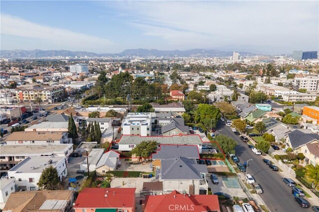 birds eye view of property featuring a city view and a mountain view