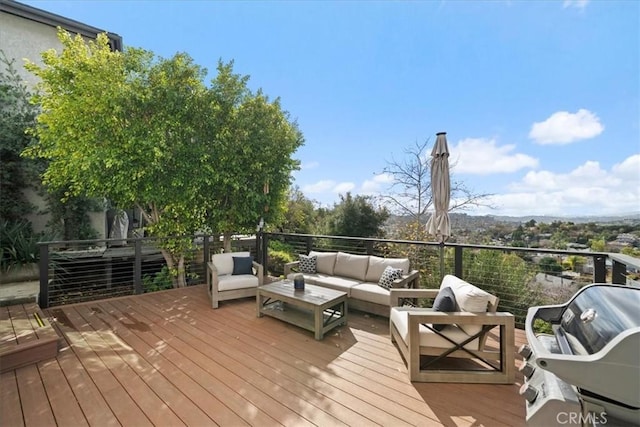 deck featuring grilling area and an outdoor hangout area