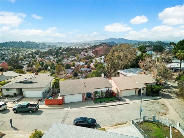 bird's eye view featuring a residential view and a mountain view