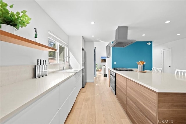 kitchen with open shelves, modern cabinets, and island exhaust hood