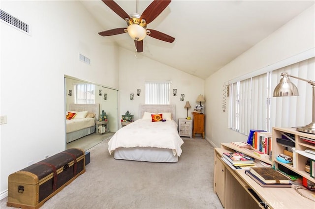 bedroom with high vaulted ceiling, light colored carpet, visible vents, and ceiling fan