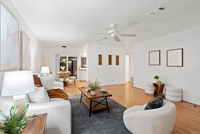 3839 Vista Campana S Unit 32, Oceanside, CA 92057 - living area with wood finished floors and a ceiling fan