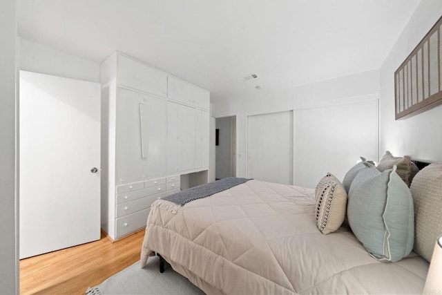 3839 Vista Campana S Unit 32, Oceanside, CA 92057 - bedroom with light wood-style flooring