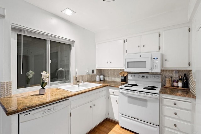 3839 Vista Campana S Unit 32, Oceanside, CA 92057 - kitchen featuring white appliances, a sink, and decorative backsplash