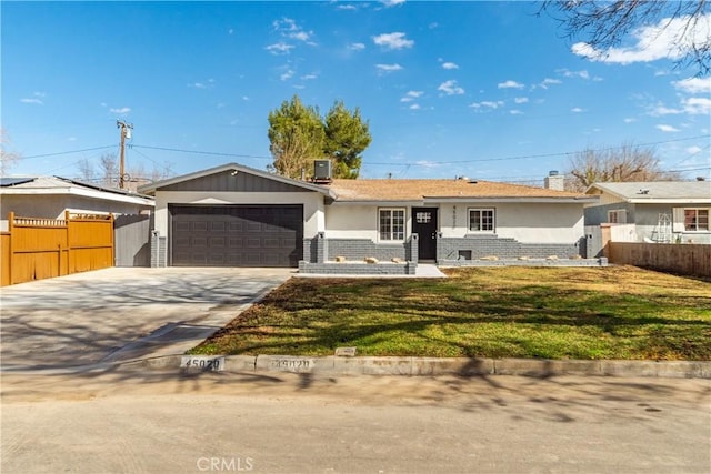 ranch-style house featuring a garage, brick siding, fence, driveway, and a front lawn