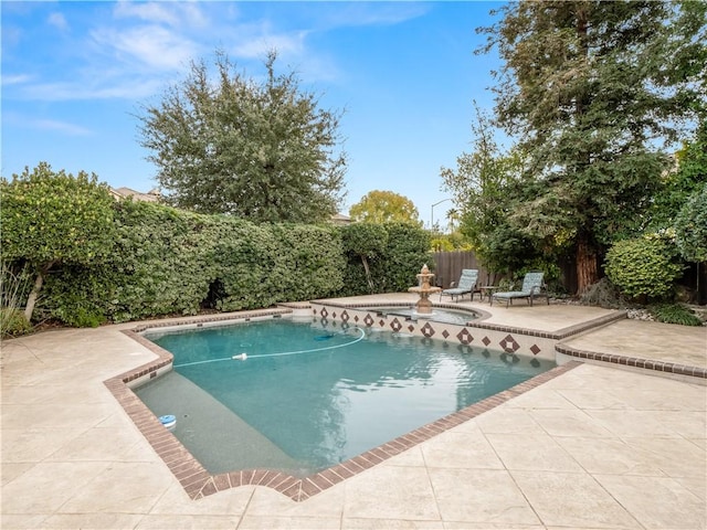 view of swimming pool with a fenced in pool, a patio area, and a fenced backyard