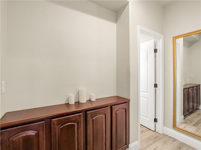 hallway featuring light wood finished floors