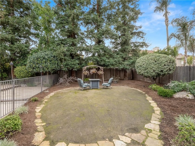 view of yard featuring a patio area and a fenced backyard