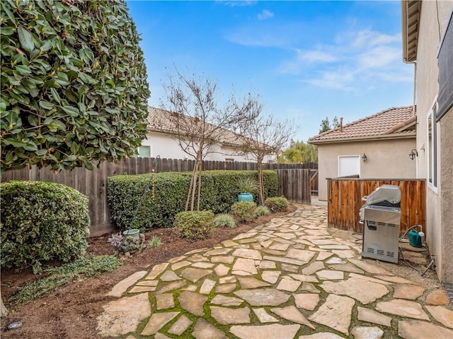 view of patio featuring area for grilling and a fenced backyard