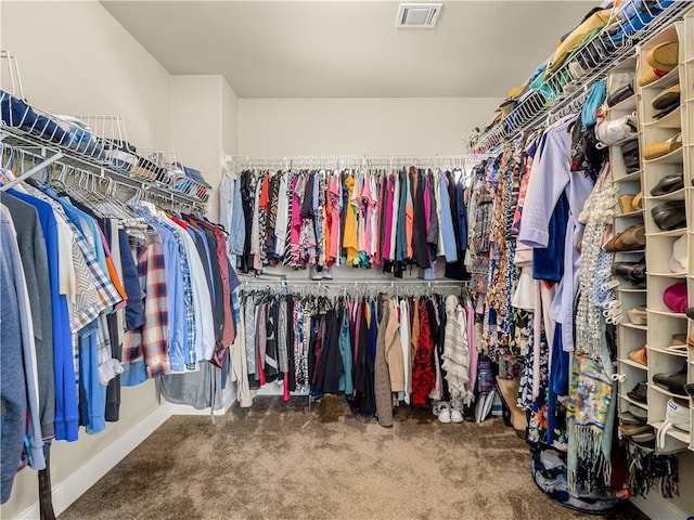 spacious closet featuring carpet and visible vents