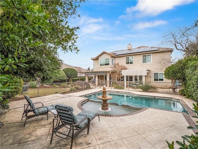 view of swimming pool with a patio area, fence, and a fenced in pool