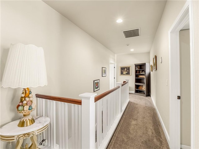 hall featuring recessed lighting, light colored carpet, an upstairs landing, baseboards, and visible vents