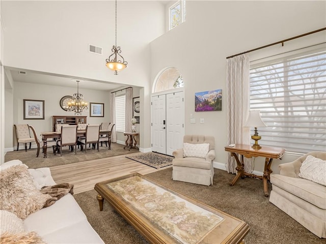 2705 E Ryan Ln, Fresno, CA 93720 - living area with a chandelier, baseboards, and a high ceiling