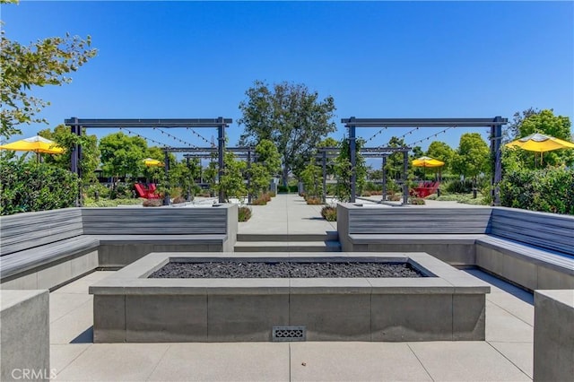 view of property's community featuring a fire pit