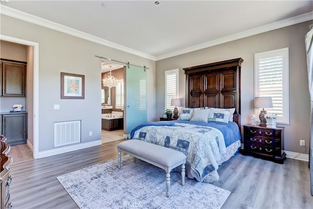 bedroom featuring visible vents, light wood-style floors, ornamental molding, and a chandelier