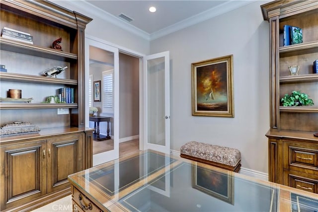 office space featuring visible vents, crown molding, built in shelves, recessed lighting, and french doors