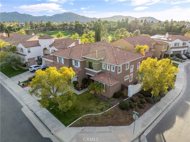 birds eye view of property with a residential view and a mountain view