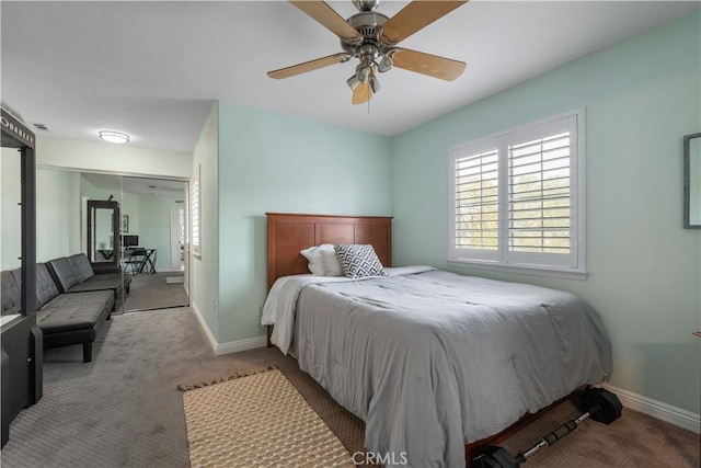 carpeted bedroom with visible vents, ceiling fan, and baseboards