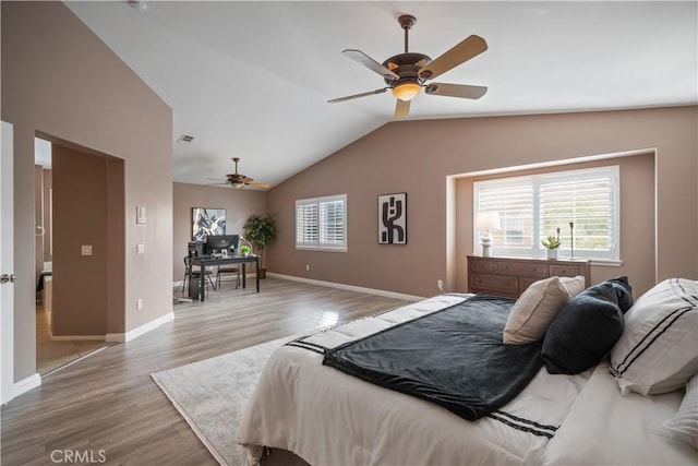 bedroom with visible vents, baseboards, lofted ceiling, ceiling fan, and wood finished floors