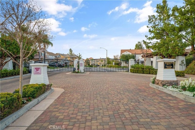 view of gate with a residential view