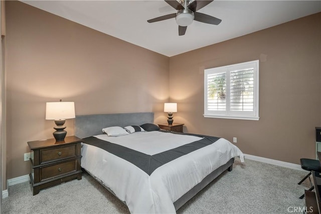 bedroom with carpet, ceiling fan, and baseboards