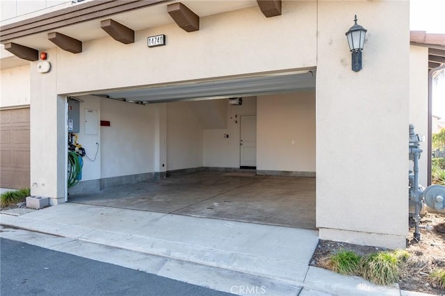 garage with concrete driveway