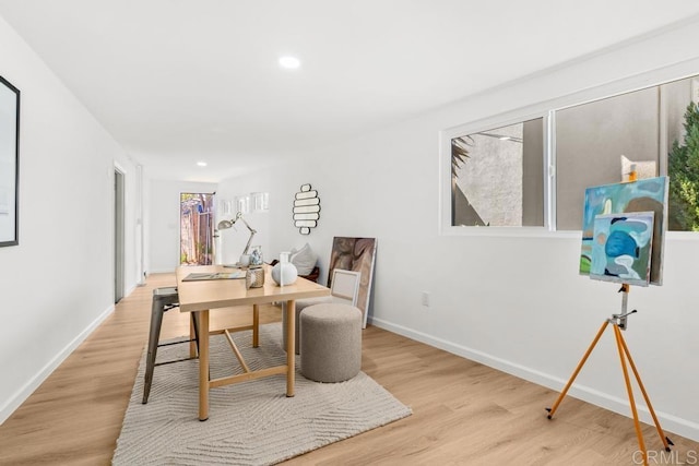 office space with recessed lighting, wood finished floors, and baseboards